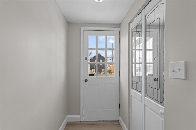 doorway with light hardwood / wood-style floors