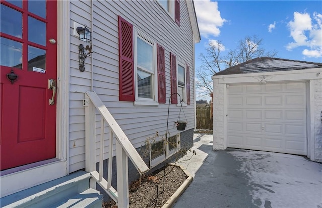 view of home's exterior with a garage and an outdoor structure