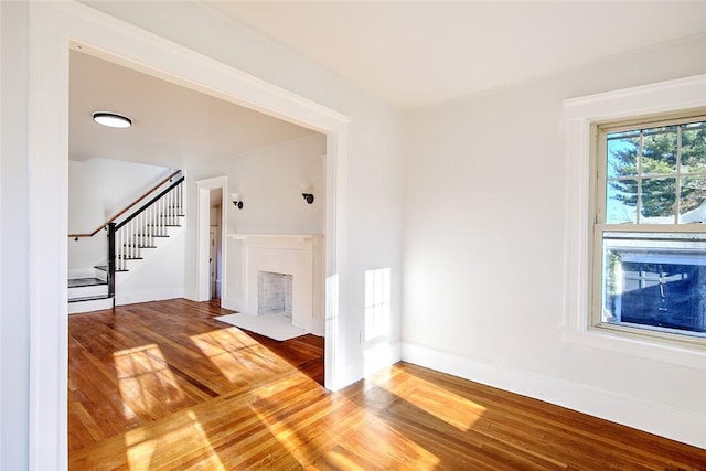 unfurnished living room with hardwood / wood-style floors