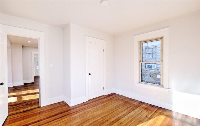 empty room with wood-type flooring