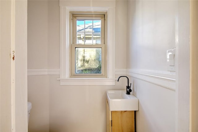 bathroom with vanity and toilet