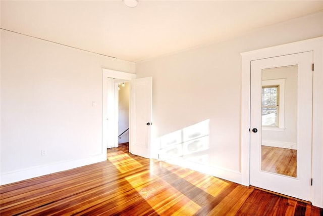 spare room featuring hardwood / wood-style flooring