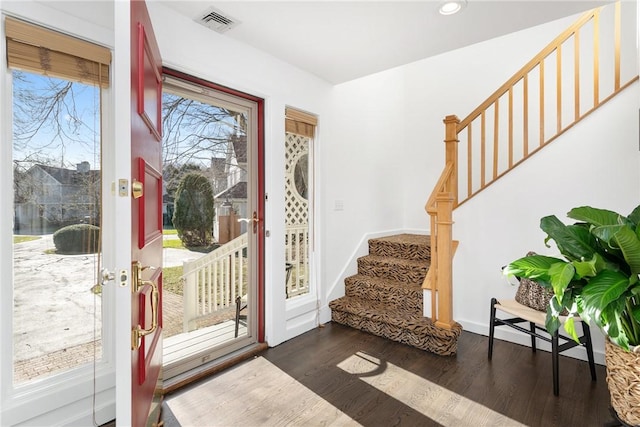 entrance foyer with dark hardwood / wood-style flooring