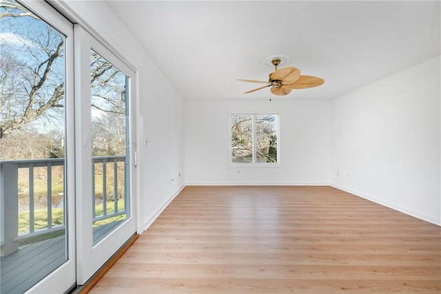 spare room with ceiling fan and light hardwood / wood-style flooring