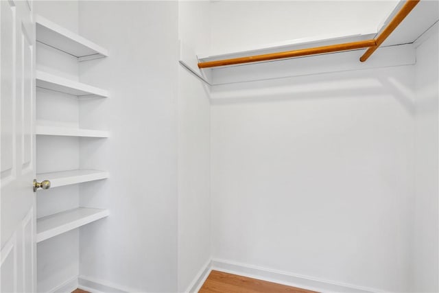 walk in closet featuring hardwood / wood-style floors