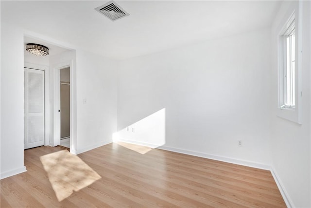 empty room with light wood-type flooring