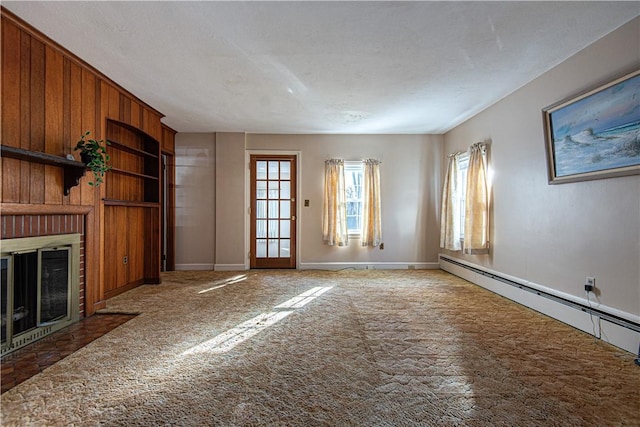 unfurnished living room with a fireplace, built in features, a textured ceiling, and baseboard heating