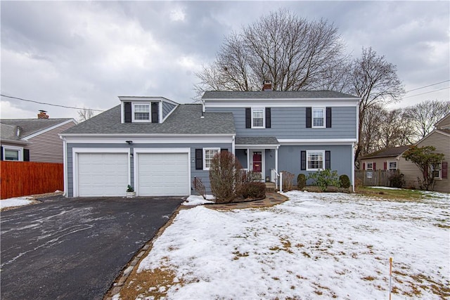 front of property with a garage