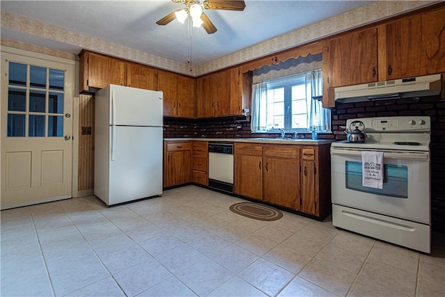 kitchen featuring tasteful backsplash, sink, white appliances, and ceiling fan