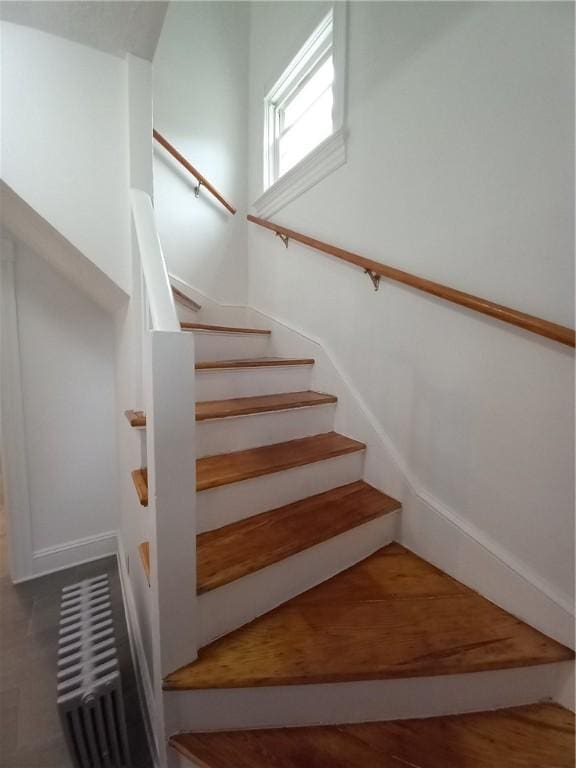 stairway featuring hardwood / wood-style flooring