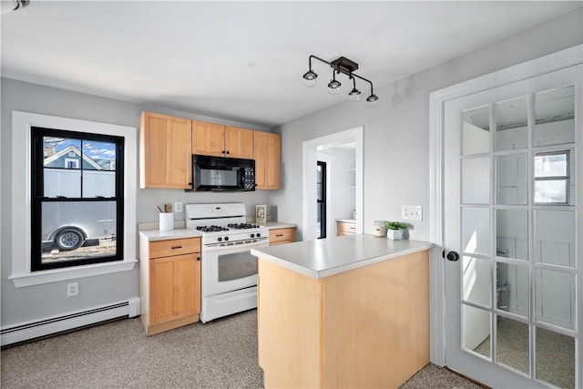 kitchen with light brown cabinetry, gas range gas stove, kitchen peninsula, and baseboard heating