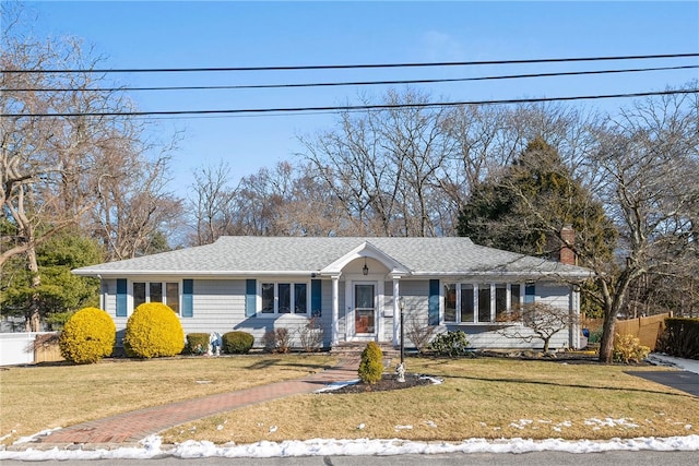 single story home with a front yard