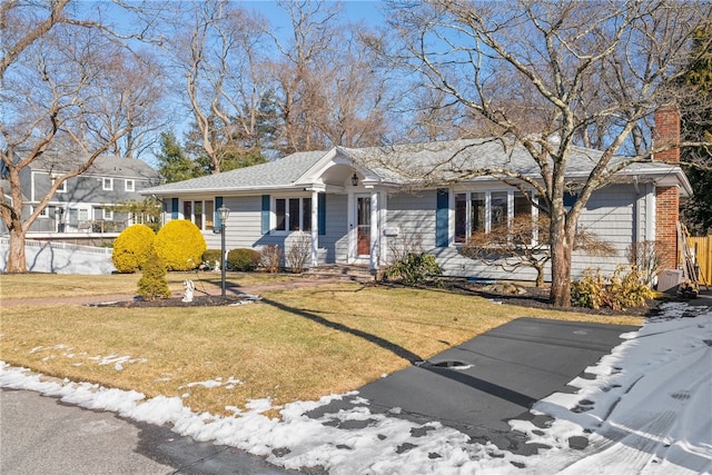 view of front of house with a yard