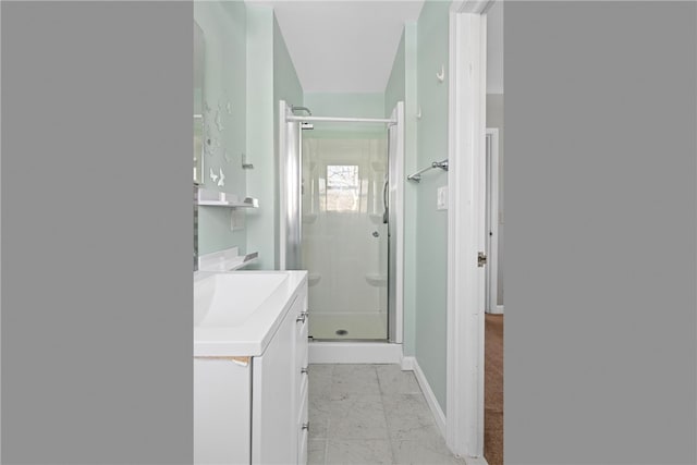 bathroom with vanity and an enclosed shower