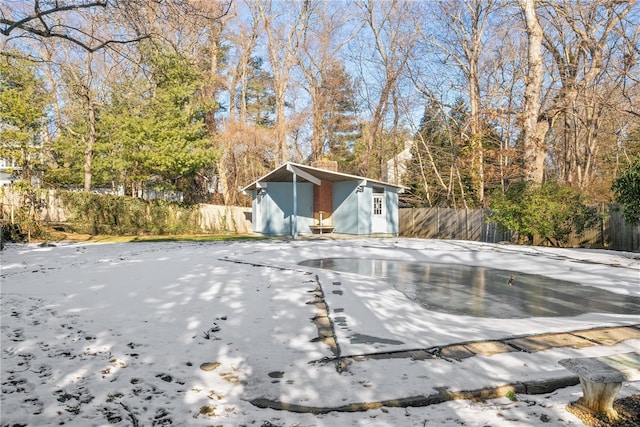 view of swimming pool with an outbuilding