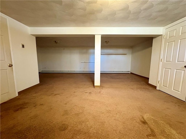 basement featuring a textured ceiling and carpet flooring