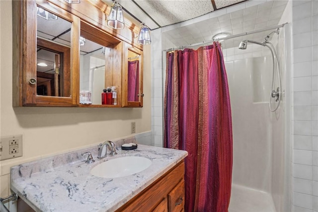 bathroom with vanity and curtained shower