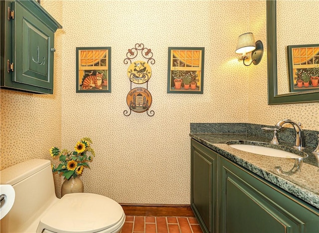 bathroom with vanity and toilet