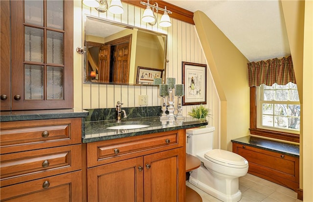 bathroom with vanity, tile patterned floors, and toilet