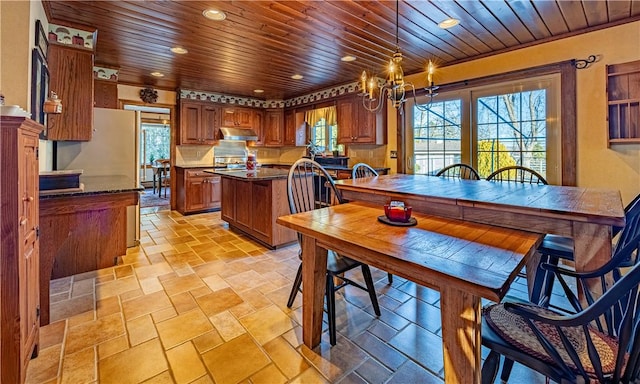 dining room with wooden ceiling and a chandelier