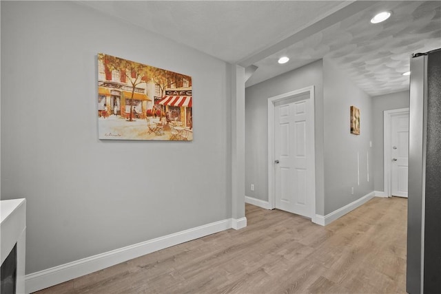 hall with light hardwood / wood-style floors