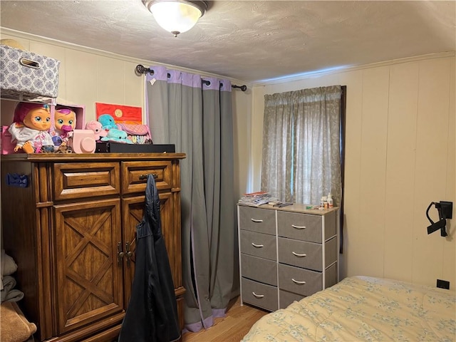 bedroom with light hardwood / wood-style flooring