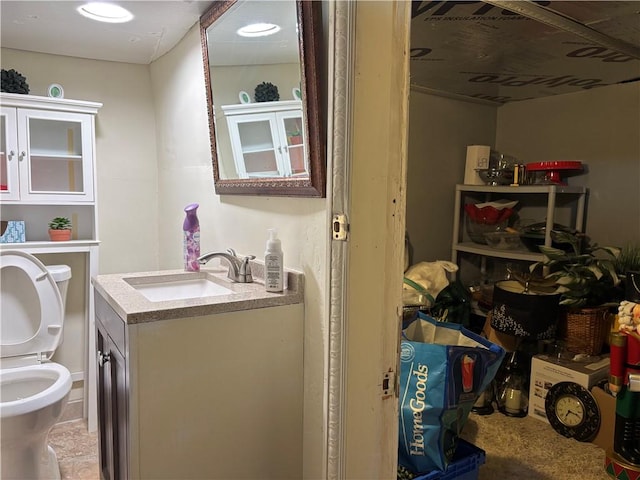 bathroom featuring vanity and toilet