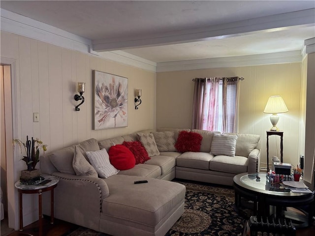 living room with beam ceiling and ornamental molding