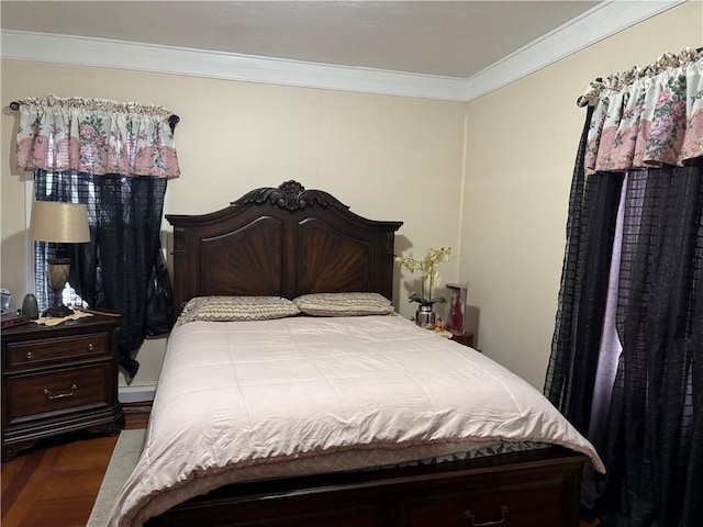 bedroom featuring ornamental molding and dark hardwood / wood-style floors