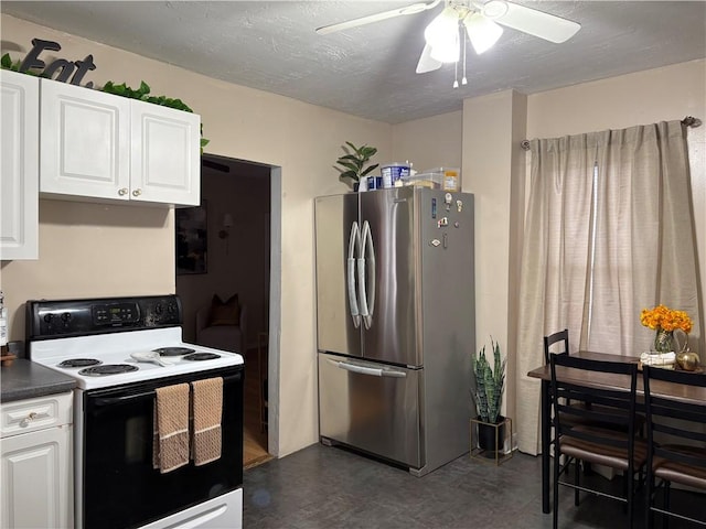 kitchen with a textured ceiling, stainless steel fridge, range with electric cooktop, and white cabinets