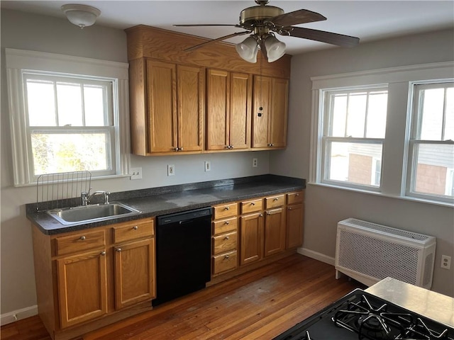 kitchen with sink, dishwasher, ceiling fan, a wall mounted AC, and dark hardwood / wood-style flooring