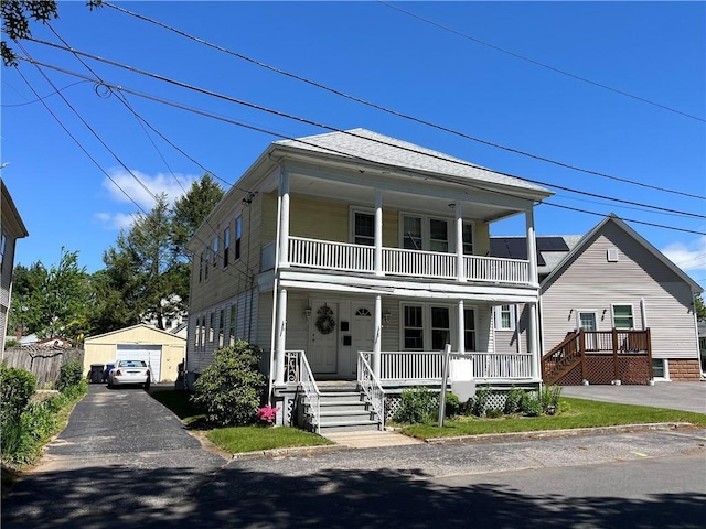 6 David St, East Providence, RI 02916 - view of front facade with covered porch, a garage, a balcony, an outdoor structure, and asphalt driveway