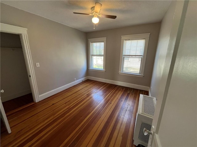 6 David St, East Providence, RI 02916 - unfurnished room featuring baseboards, dark wood-style floors, and a ceiling fan