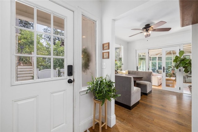 doorway featuring ceiling fan and wood-type flooring