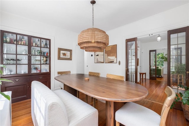 dining space featuring light wood-type flooring