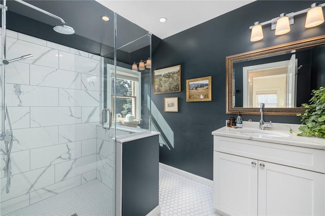 bathroom featuring vanity and a shower with shower door