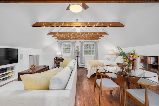 living room with dark hardwood / wood-style floors, lofted ceiling with beams, and a baseboard heating unit