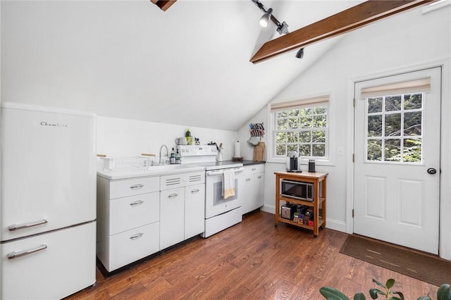 kitchen with white cabinetry, vaulted ceiling with beams, white appliances, and dark wood-type flooring