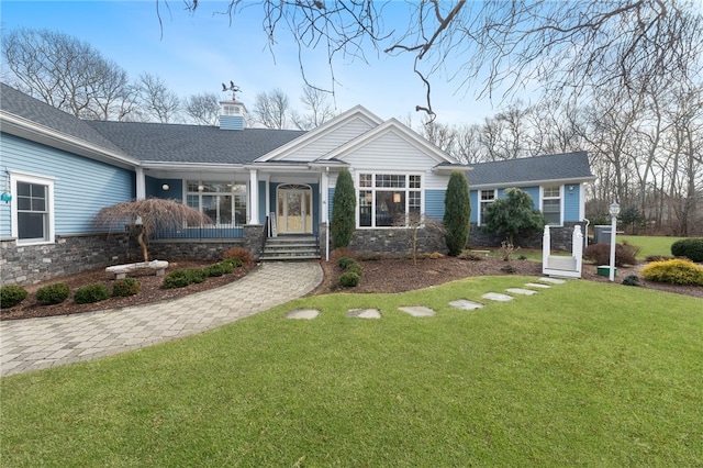 view of front of property with a front lawn