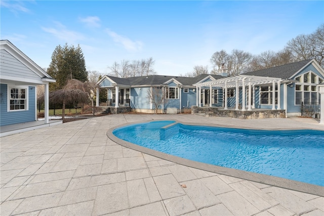 view of pool with a pergola and a patio