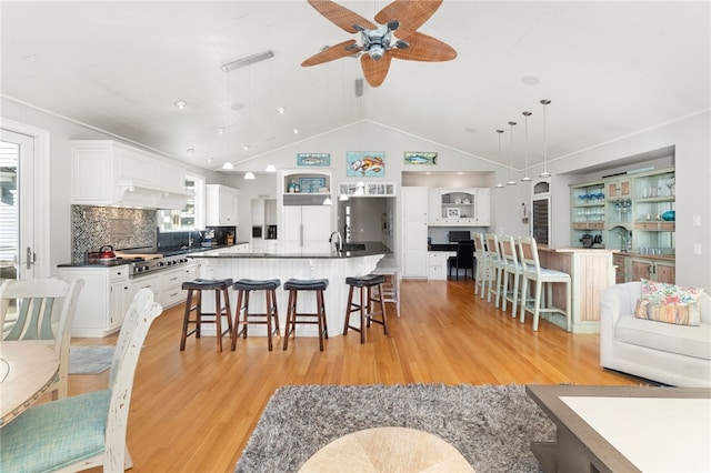 kitchen with white cabinetry, a large island, and pendant lighting