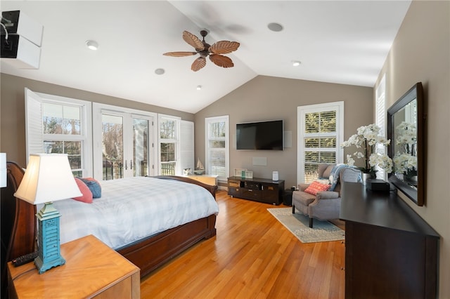 bedroom with lofted ceiling, ceiling fan, and light wood-type flooring