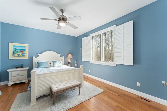 bedroom featuring hardwood / wood-style flooring and ceiling fan