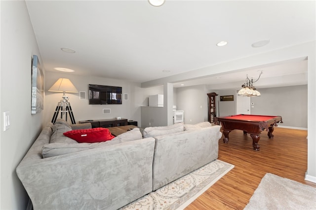 living room featuring pool table and light hardwood / wood-style flooring