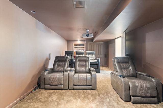 home theater with light colored carpet