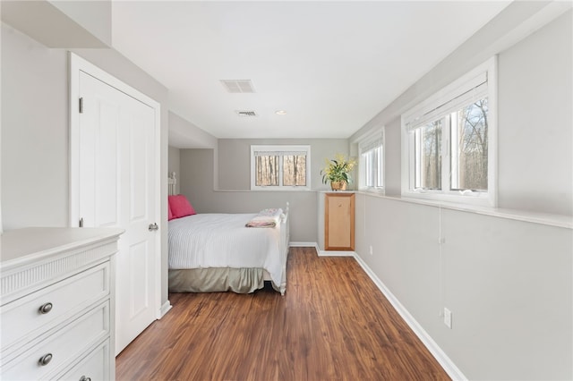 bedroom featuring dark wood-type flooring