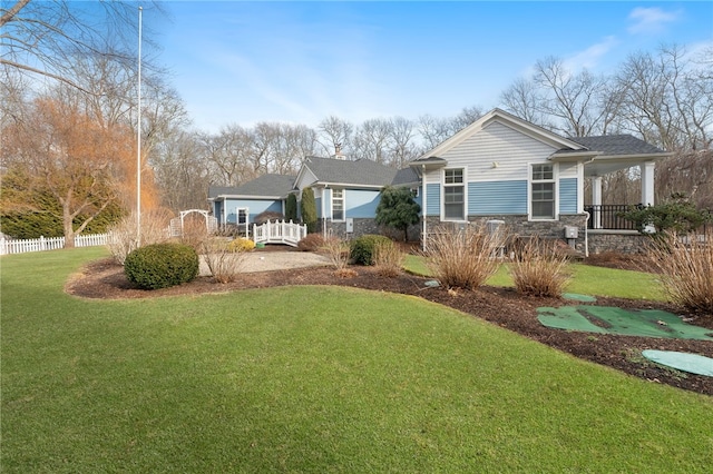 exterior space with a porch and a front yard