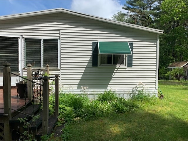 view of home's exterior with a lawn