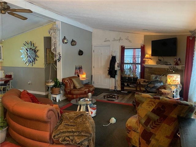 living room featuring hardwood / wood-style flooring, vaulted ceiling, and ceiling fan