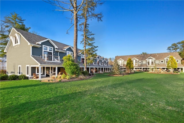 view of yard with a balcony